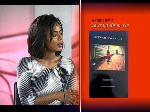 Le train de la vie, livre de Merry Bey continue d'embarquer du monde, après diverses stations, le voici sur le plateau d'impressions de Sada kan